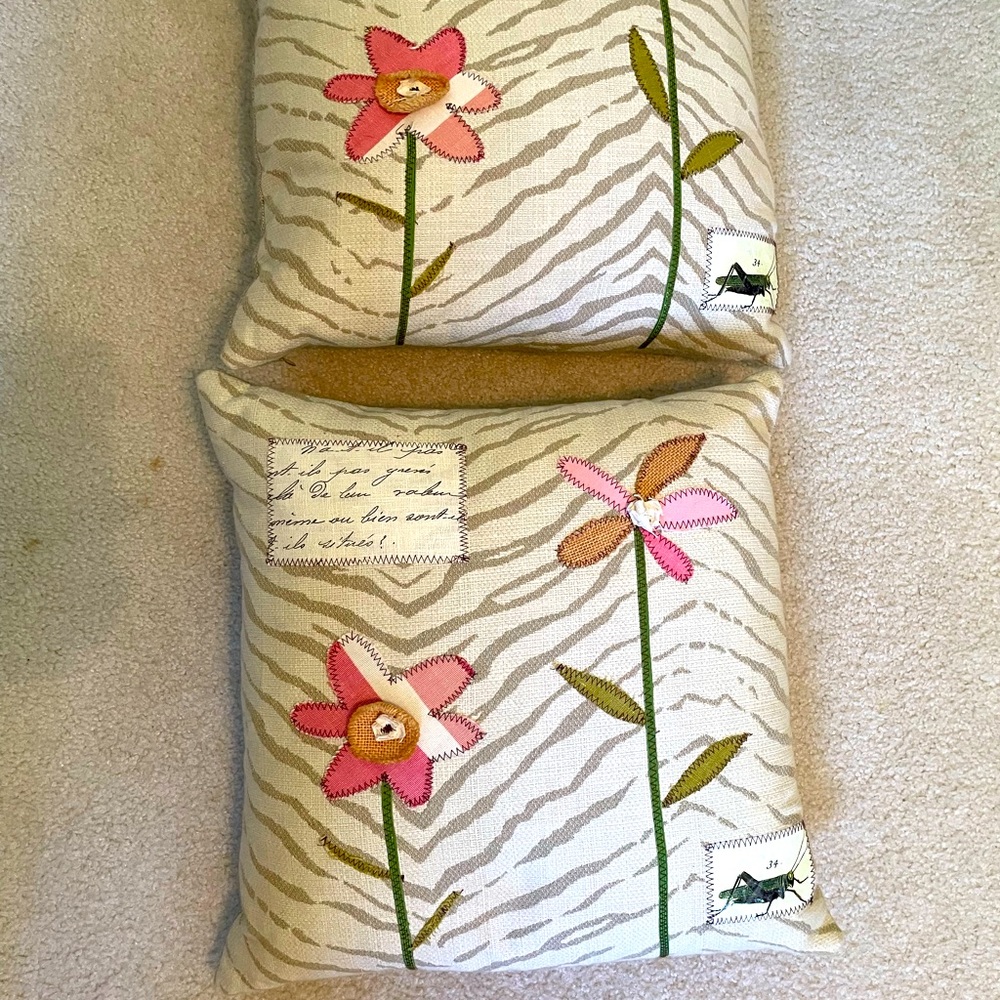 Two floral / garden motif pillows